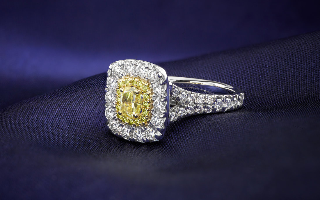Yellow diamond halo engagement ring